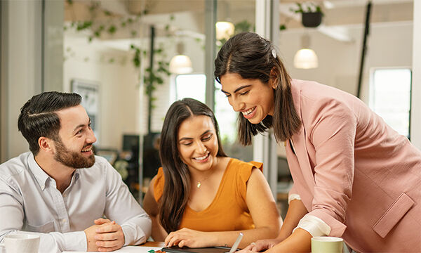 Three people in discussion